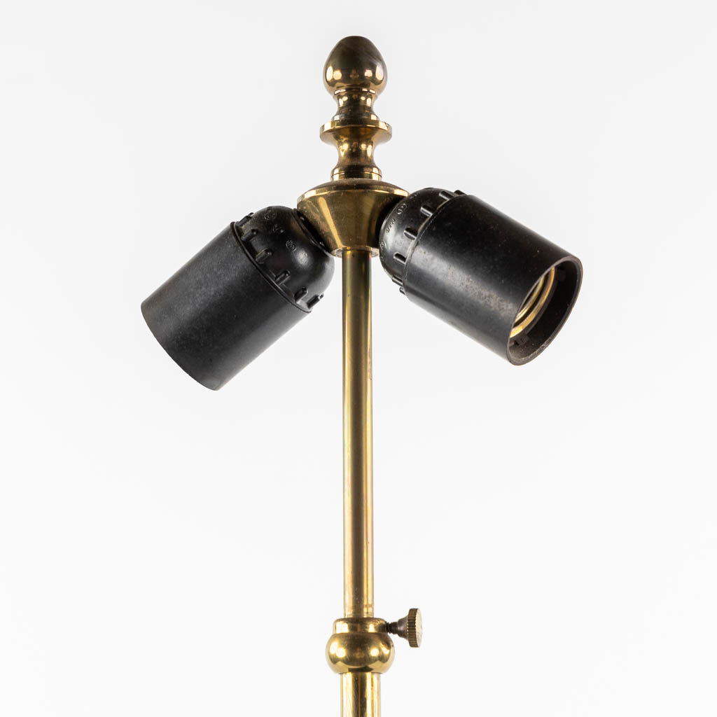 A pair of black-lacqured and brass inlay table lamps, in the style of Maison Jansen. (L:16 x W:24 x H:83 cm)