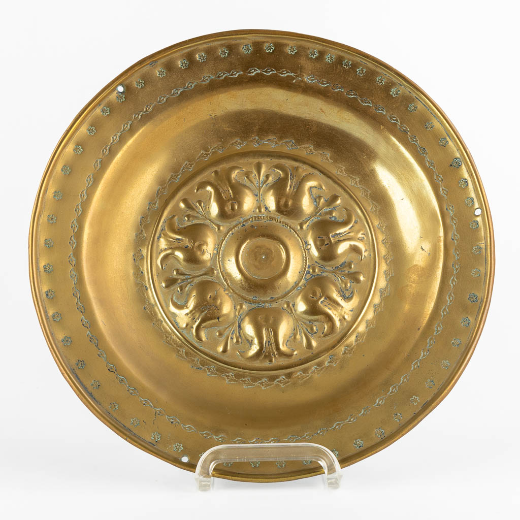 A brass Alms Dish depicting 'Tulips', 16th C. (D:34 cm)