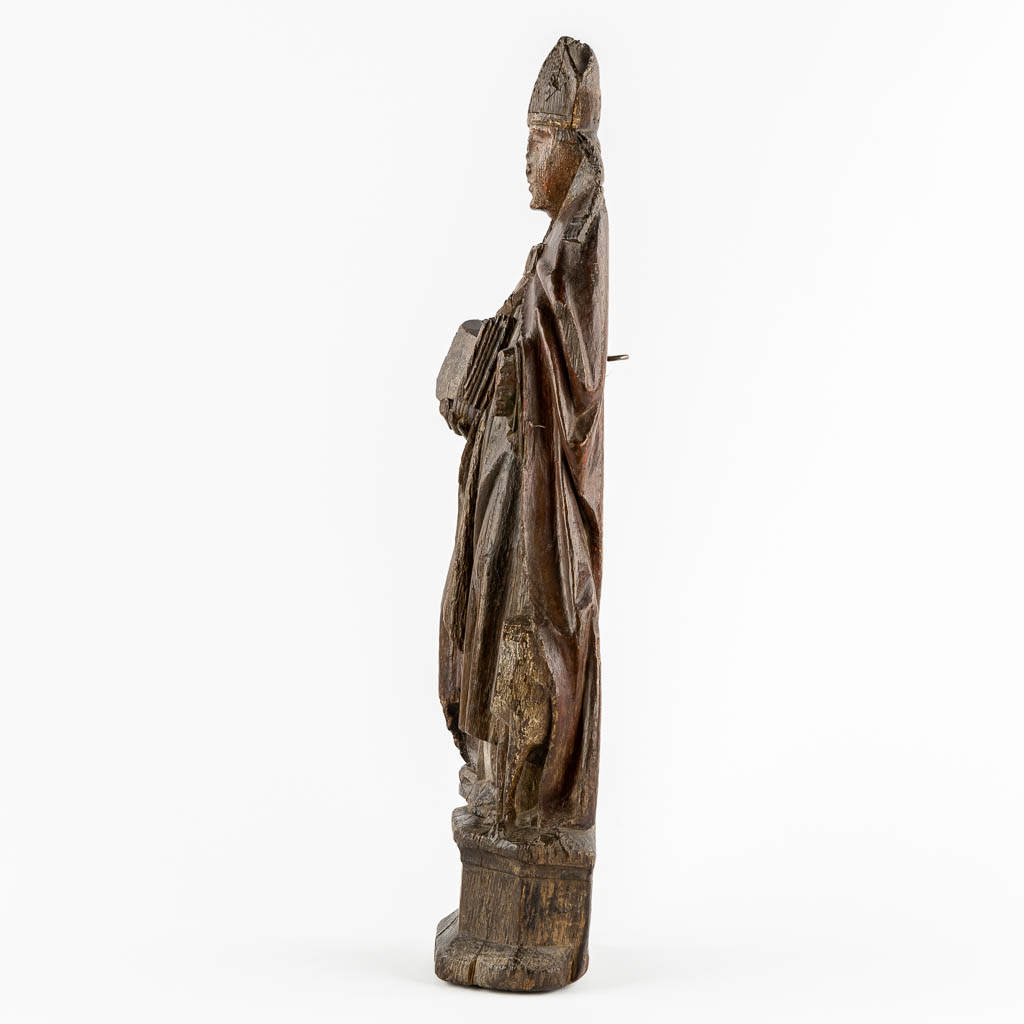 An antique wood-sculptured figurine of Saint Hubert of Liège, 17th/18th C.