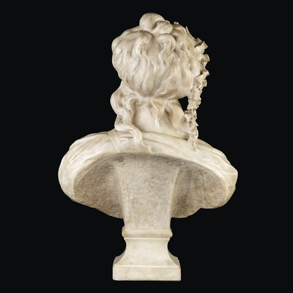 An elegant bust of a half-naked lady, sculptured marble. 19th C. (L:26 x W:45 x H:64 cm)