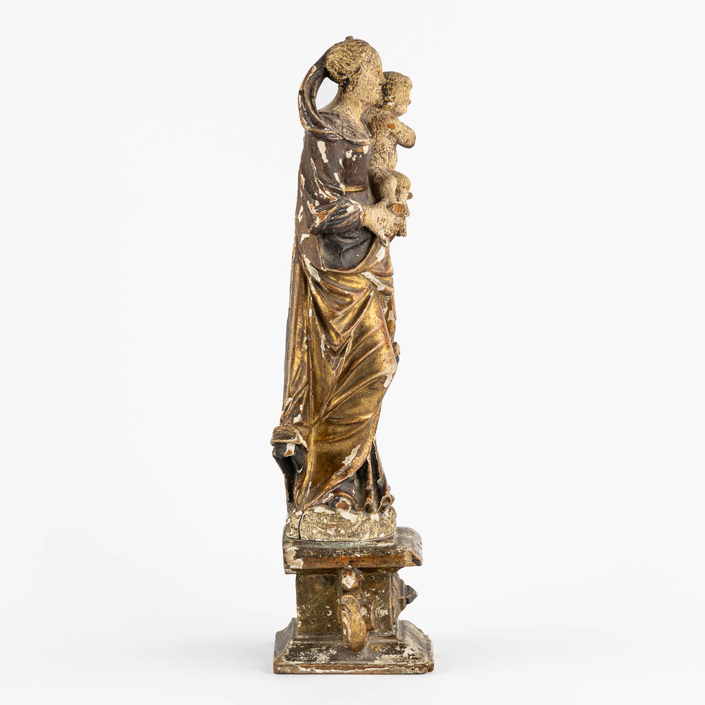 An antique wood-sculptured figurine of Madonna with a Child. 17th/18th C. (L:11,5 x W:16 x H:45 cm)