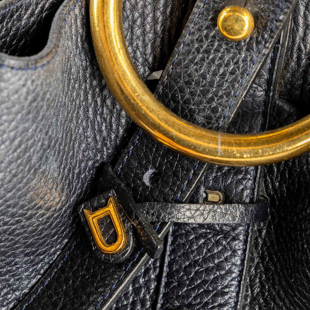 Delvaux 'Rose Des Vents', a dark blue leather handbag.