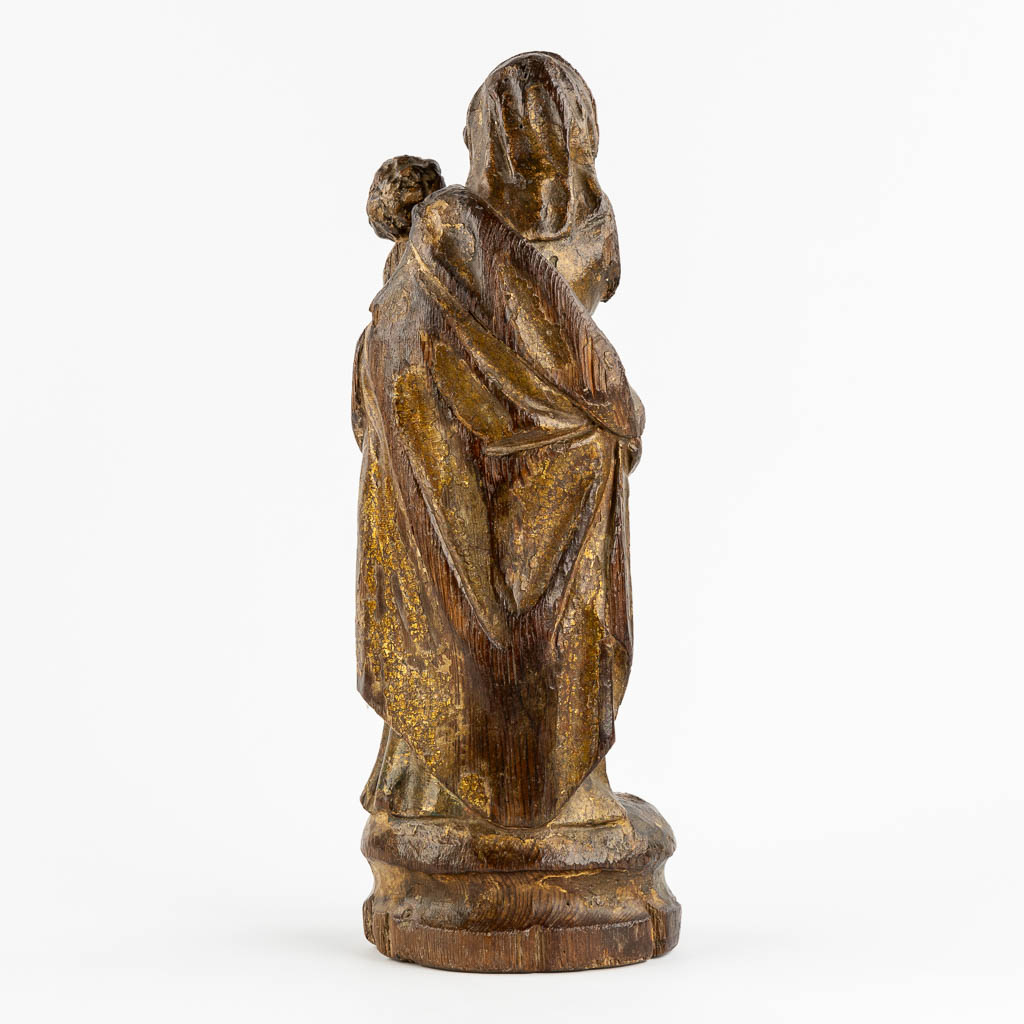 An antique wood-sculptured figurine of Madonna with a Child. 17th/18th C. (L:12 x W:16 x H:46 cm)