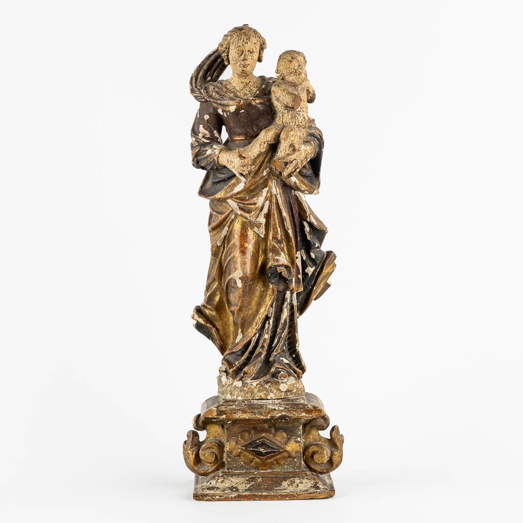 An antique wood-sculptured figurine of Madonna with a Child. 17th/18th C. (L:11,5 x W:16 x H:45 cm)