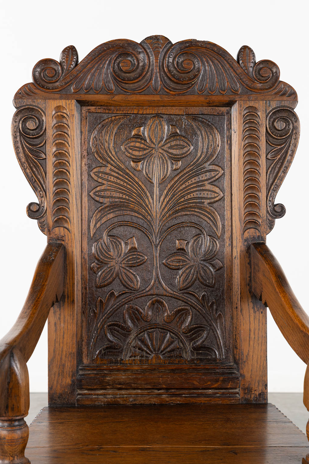 A wood-sculptured armchair, Flanders, 18th C. (L:55 x W:55 x H:117 cm)