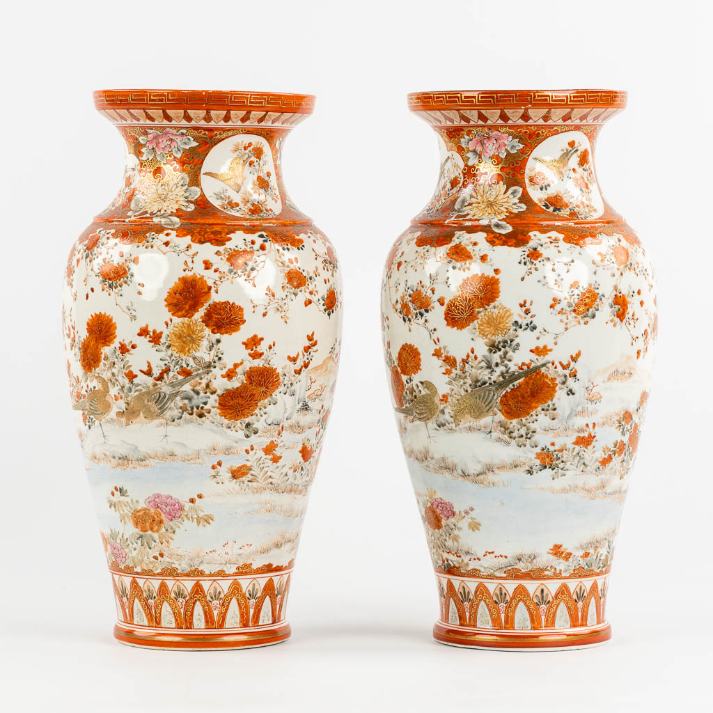 A pair of Japanese Kutani vases, richly finished with a peacock decor. (H:37 x D:19 cm)