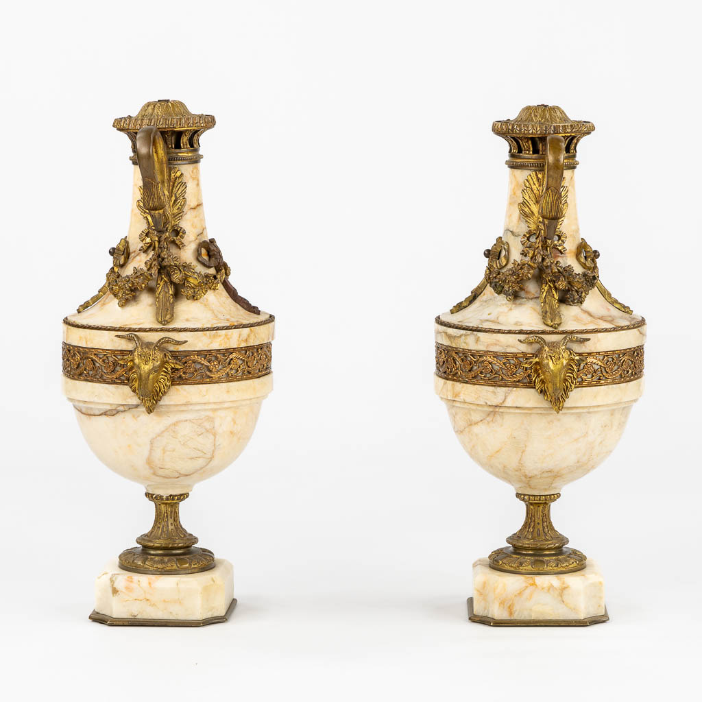 A pair of marble cassolettes, marble mounted with bronze in Louis XVI style. Ram