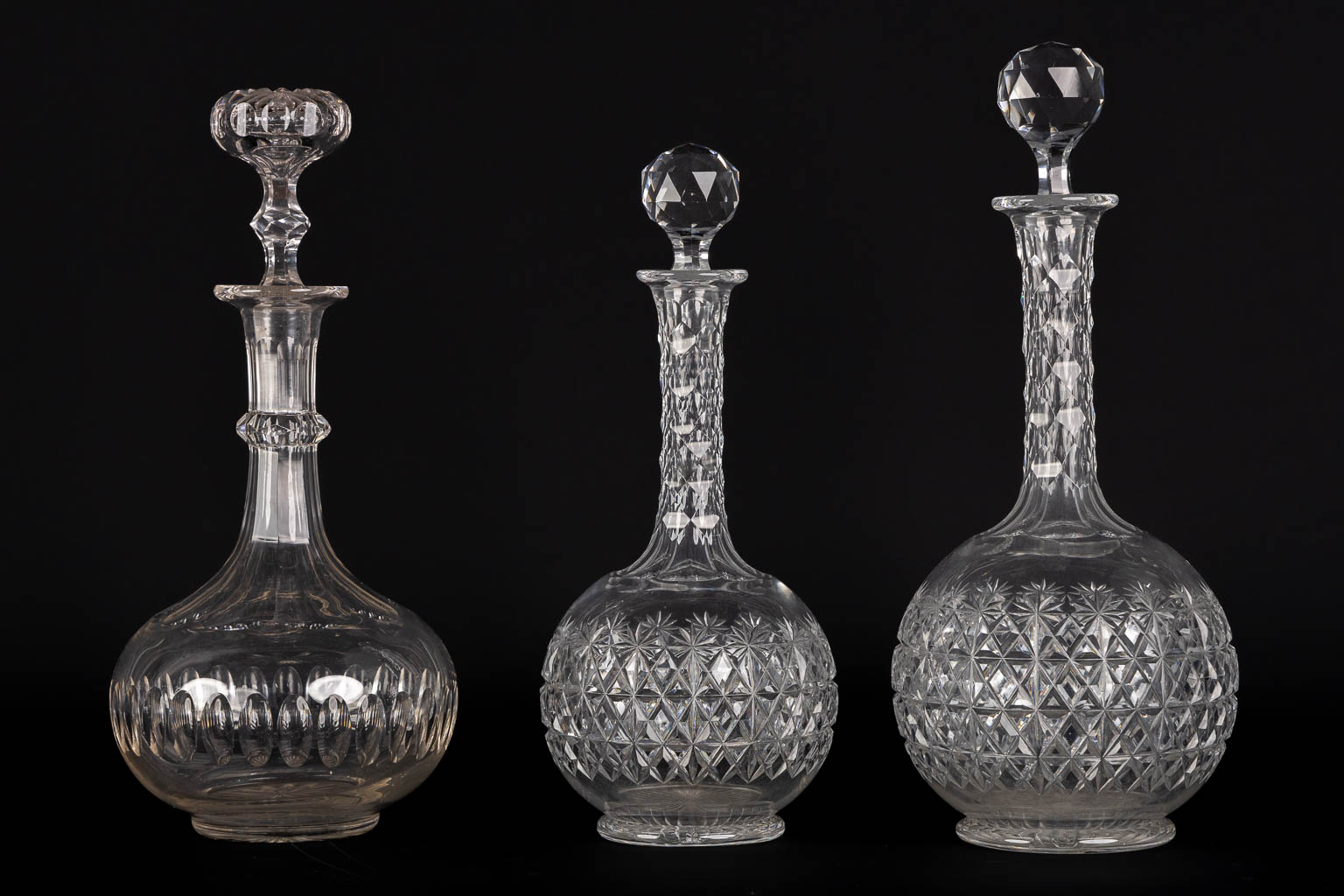 A matching set of 8 caraffes, added are a pair. Cut crystal. (H:34 cm)