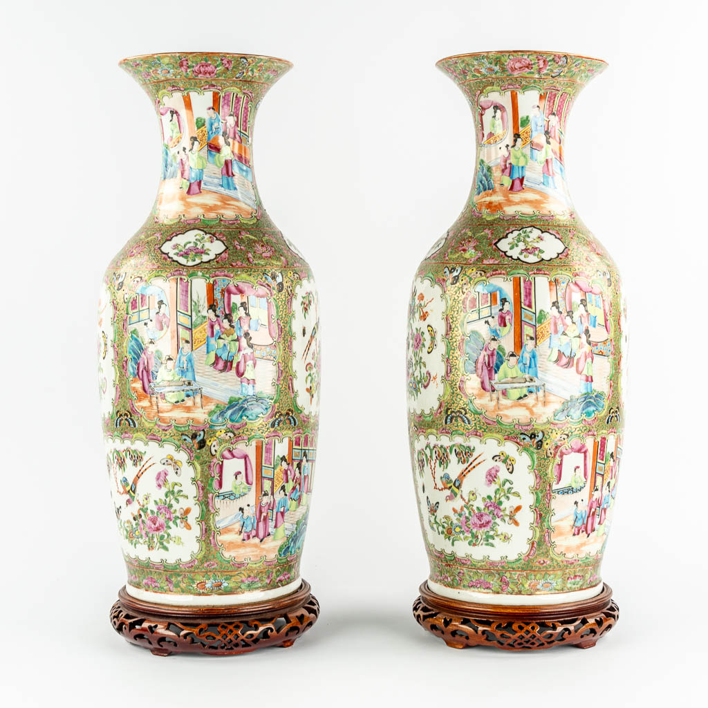 A pair of Chinese Canton vases, decorated with Ladies, fauna & flora, 19th C.