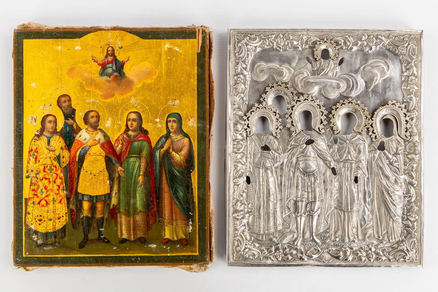 A Russian Family Icon depicting saints, martyrs and Christ, Silver Rizza, dated 1857. (W:23 x H:28 cm)