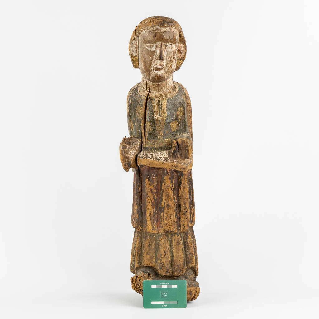 An antique wood sculpture of a Deacon, Roman period, possibly Catalonia. 12th C. (L:14 x W:15 x H:57 cm)