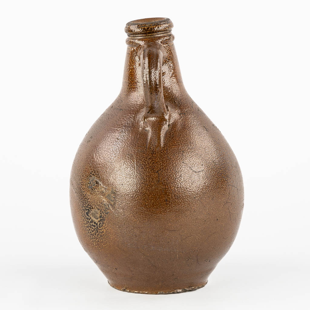 An antique Bartmann jug with three stamps, 17th C. (H:27 x D:17 cm)