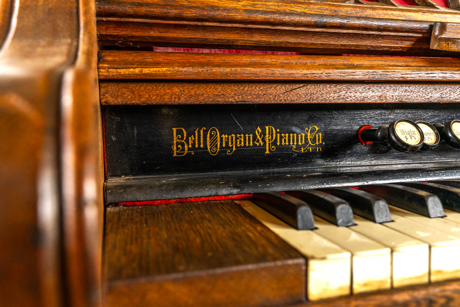 An antique organ, sculptured wood in Gothic Revival style. Circa 1900.