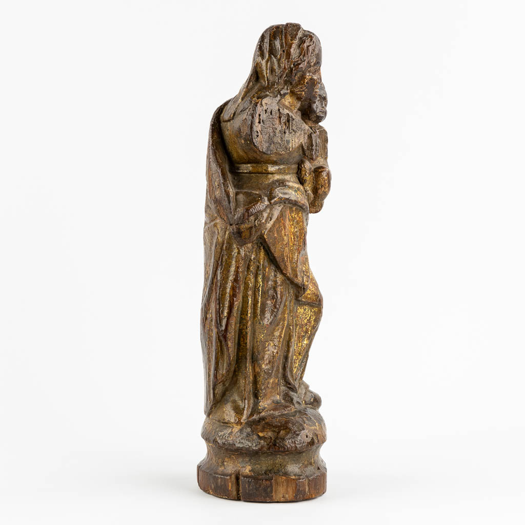 An antique wood-sculptured figurine of Madonna with a Child. 17th/18th C. (L:12 x W:16 x H:46 cm)