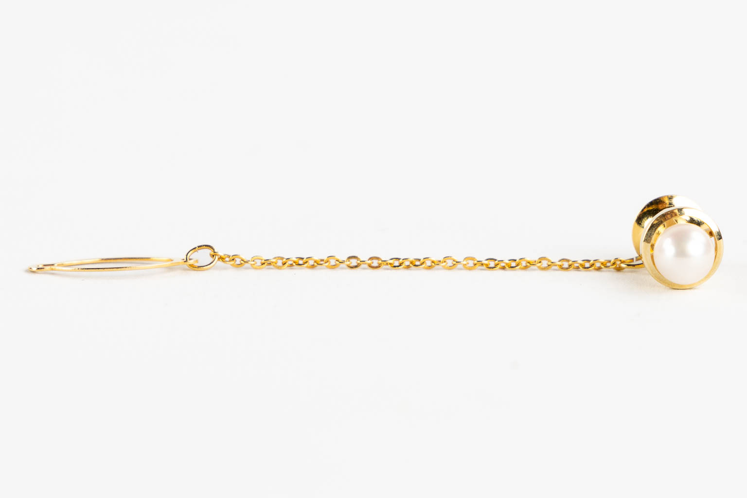 Mikimoto, a pearl necklace and tie clasp, 14kt white and yellow gold, 1965. 