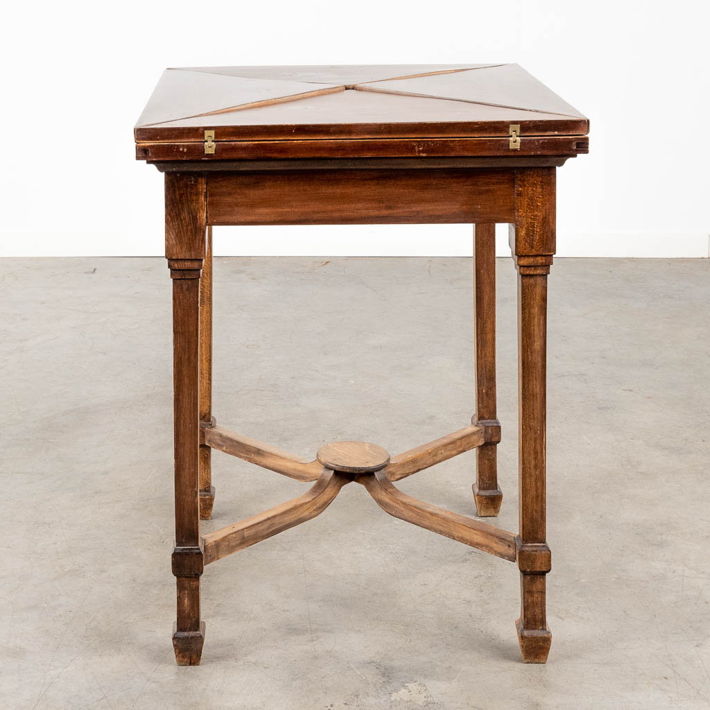 An antique game table with folding top. 19th C. (L:84 x W:84 x H:77 cm)