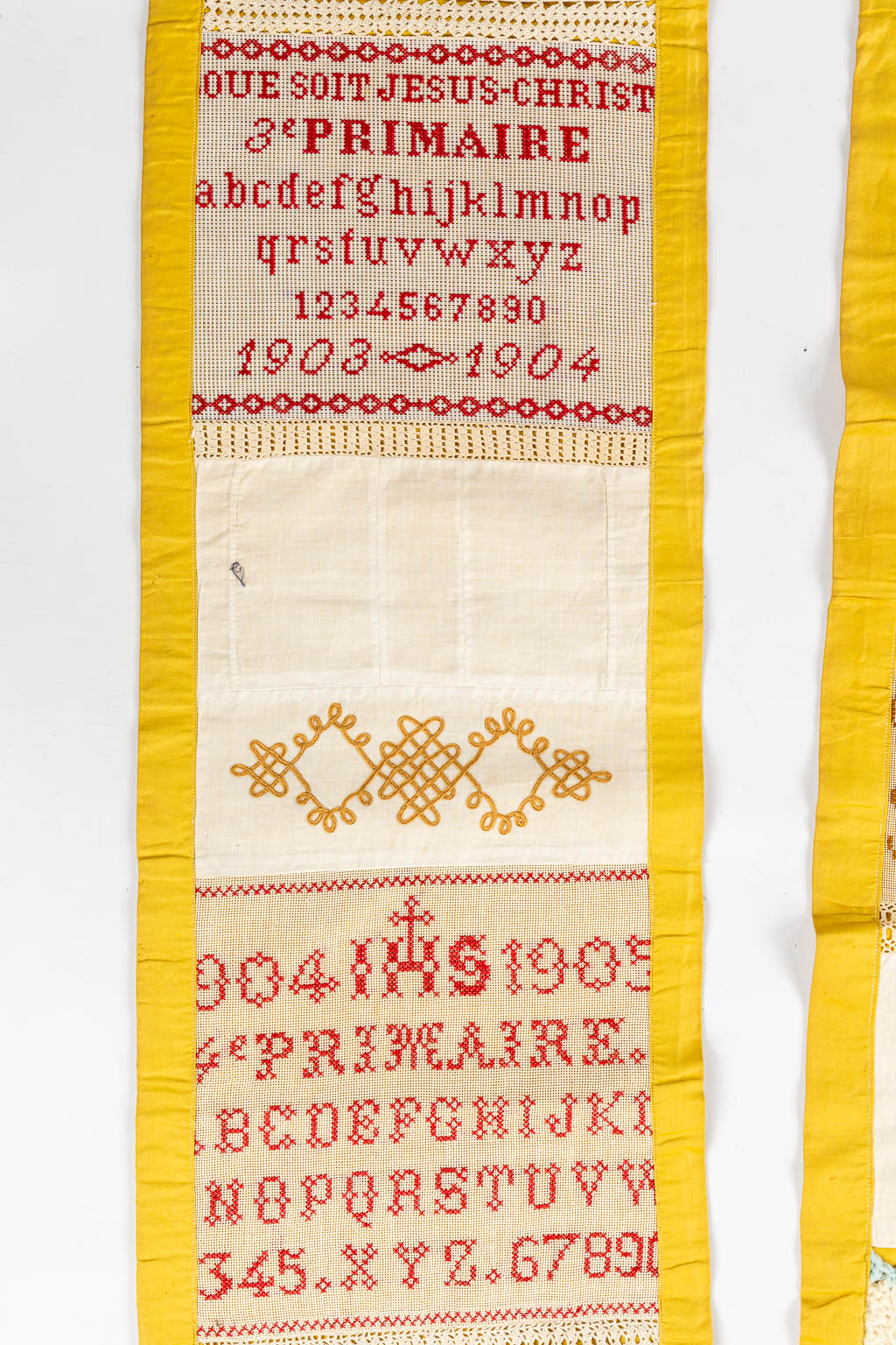 A large samplework with needlework, emboideries, knitting and lace. 1903. (L:596 cm)