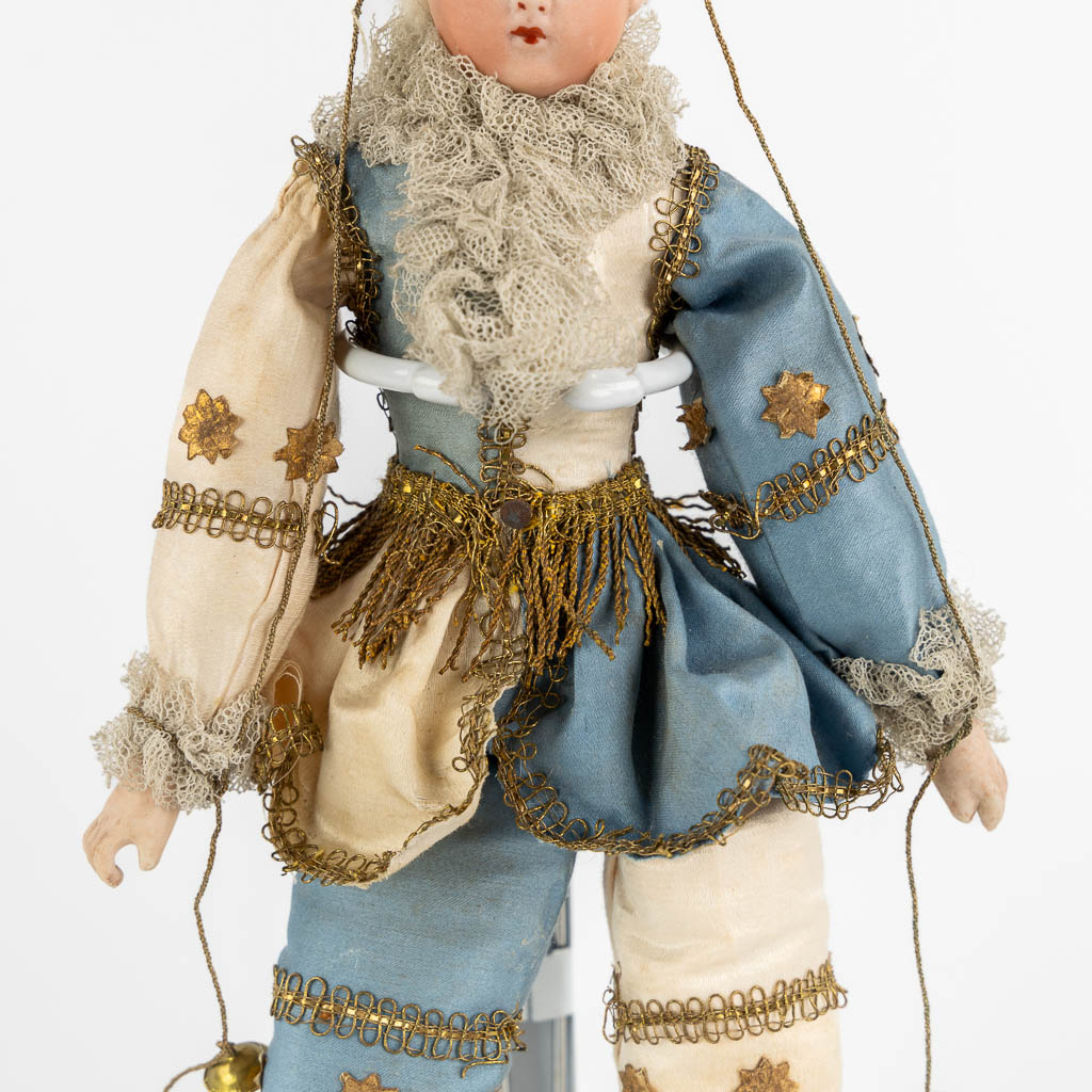 A French porcelain and fabric doll, Policinelle