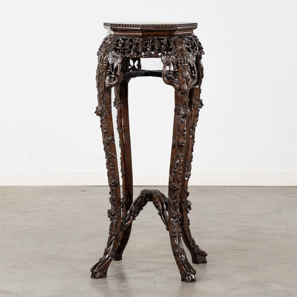 A high Oriental pedestal, sculptured hardwood with marble. (L:50 x W:50 x H:90 cm)