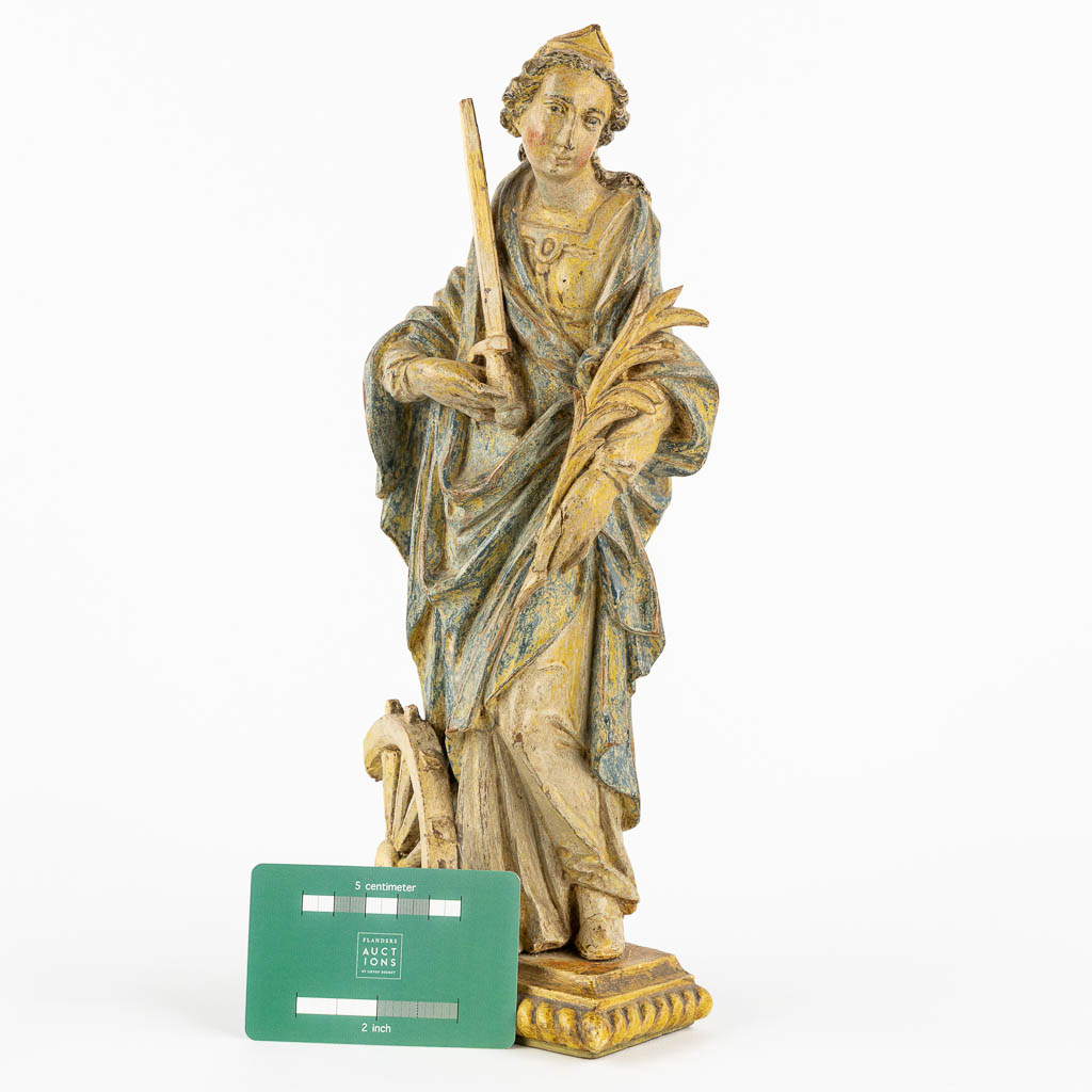 Saint Catherine, an antique wood sculpture, probably 18th C. (L:8 x W:13 x H:32 cm)