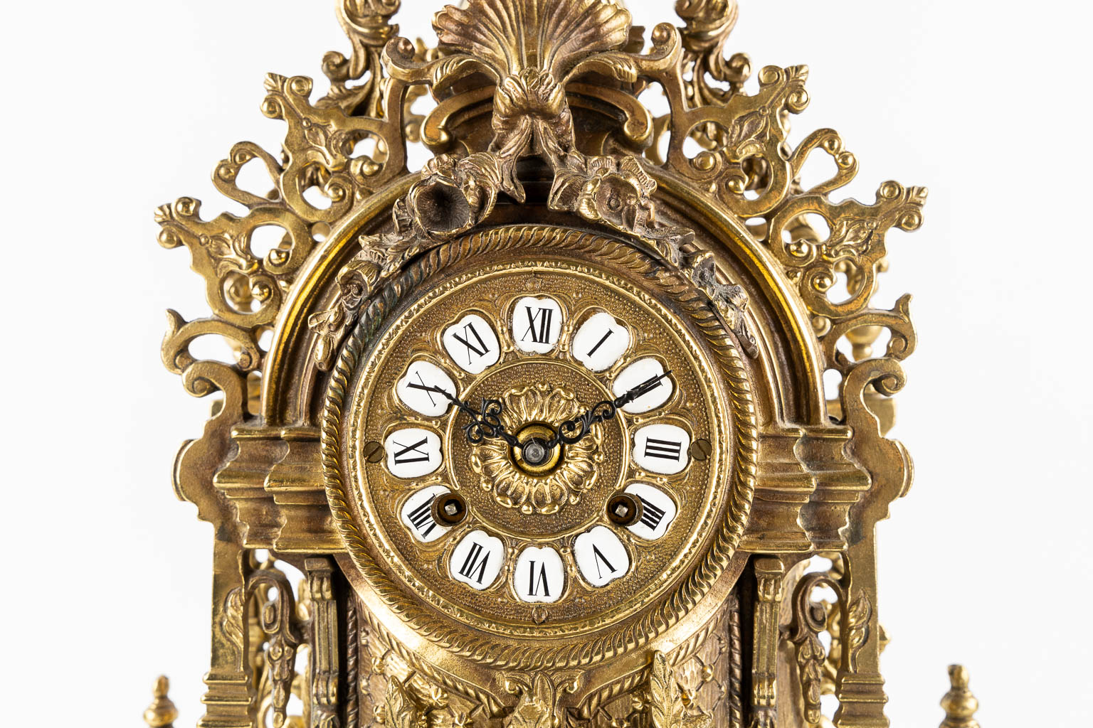 A large three-piece mantle garniture clock, polished bronze. Circa 1970.