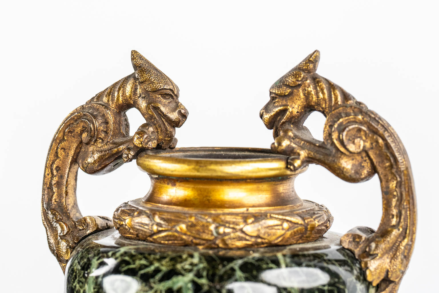 A Neoclassical three-piece mantle garniture clock and side pieces, marble and bronze. 19th C.