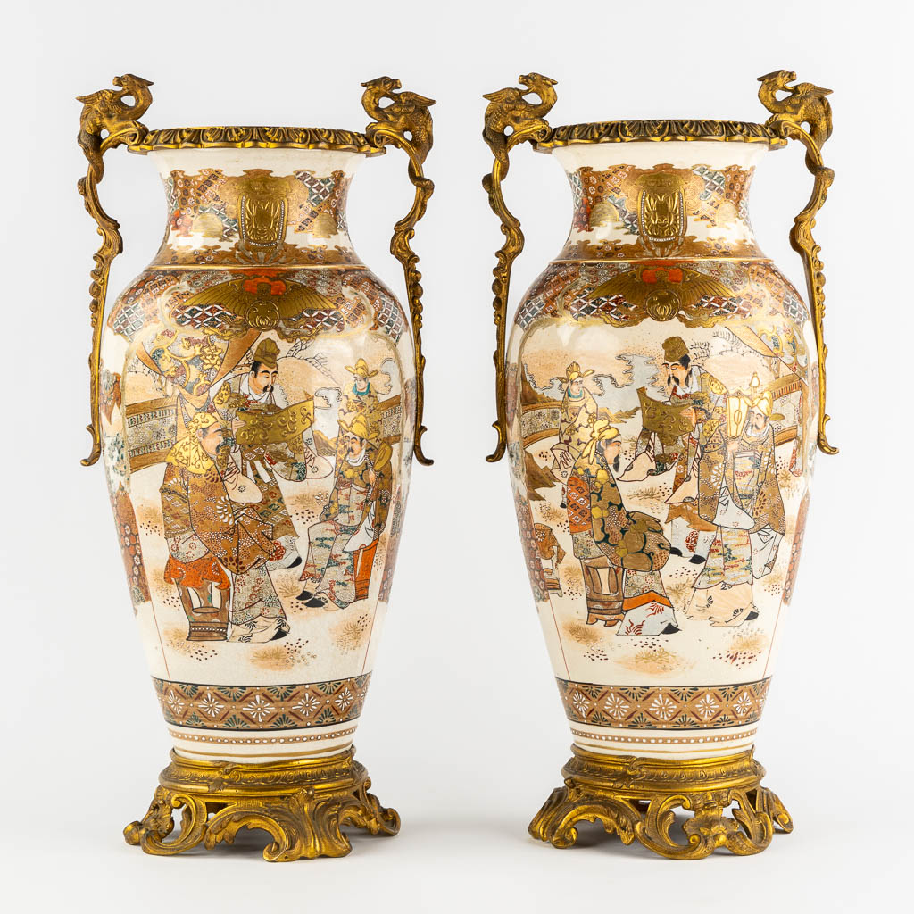 A pair of Japanese Kutani vases, mounted with bronze. Added a Chinese Canton vase. (L:24 x W:27 x H:56 cm)