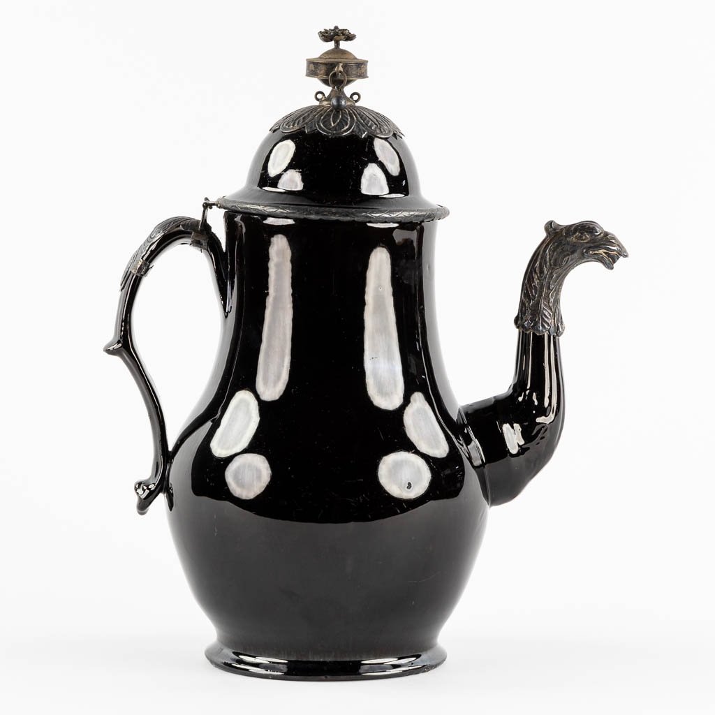 A coffe pot, glazed stoneware mounted with silver. Namur, Belgium, 18th C. (L:16 x W:24 x H:30 cm)