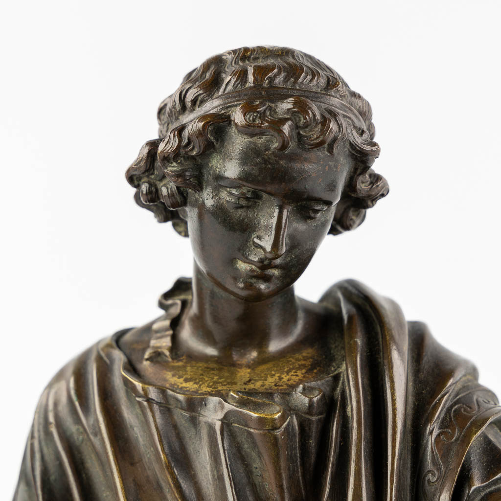 The Reading Roman, patinated bronze. 19th C. (L:23 x W:38 x H:34 cm)