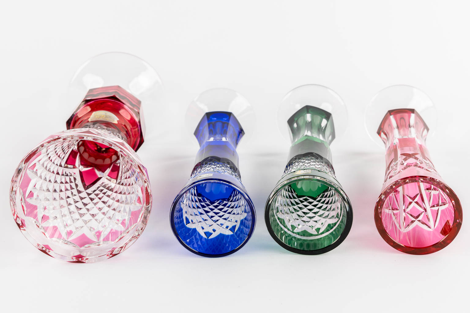 Val Saint Lambert, eight cut and coloured crystal vases. 