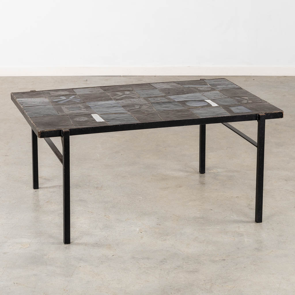 A mid-century coffee table, ceramic tiles on a metal base, circa 1970. (L:75 x W:110 x H:50 cm)