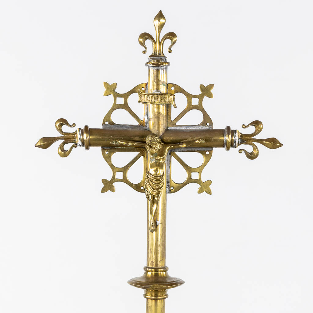 Four Processional crucifixes with their stands. Silver-plated metal and Brass. (H:265 cm)