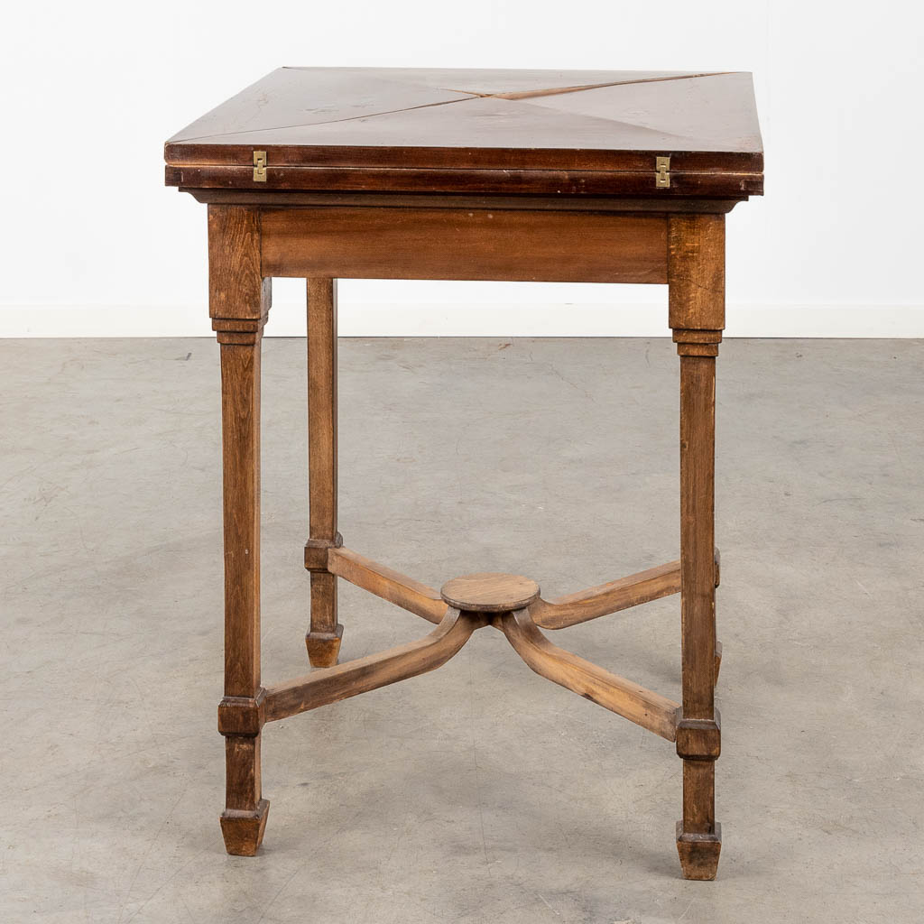 An antique game table with folding top. 19th C. (L:84 x W:84 x H:77 cm)