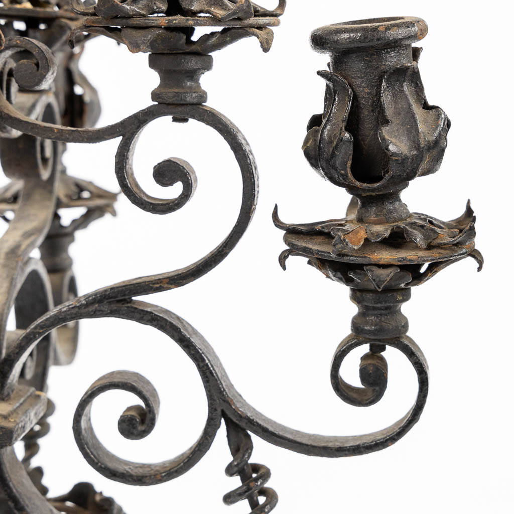 A pair of wrought-iron candelabra. Circa 1900. (L:31 x W:31 x H:57 cm)