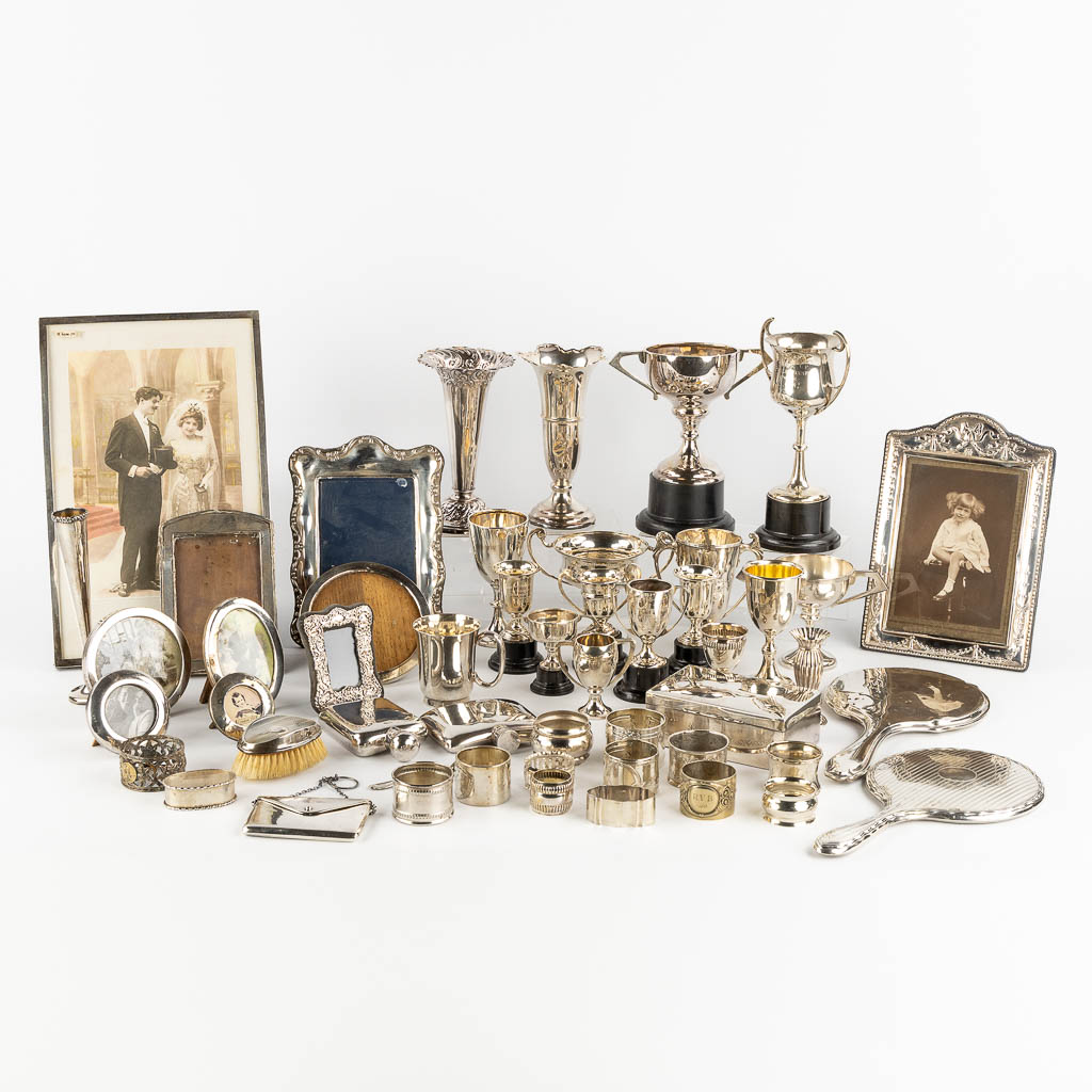 A large collection of silver items, Trophy's, picture frames, napkin holders, . England. 