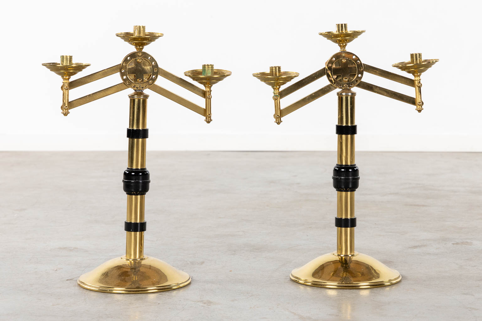 An altar crucifix with 6 candelabra, added are two large with moveable arms. (W:37 x H:51 cm)