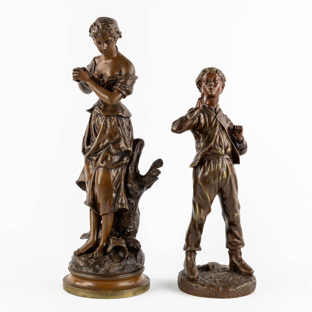 Twee gepatineerde bronzen figuren van een Dame en Roker, circa 1900.