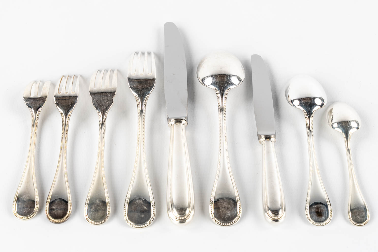 Christofle 'Perles' a 142-piece silver-plated cutlery in a Christofle chest with drawers. 