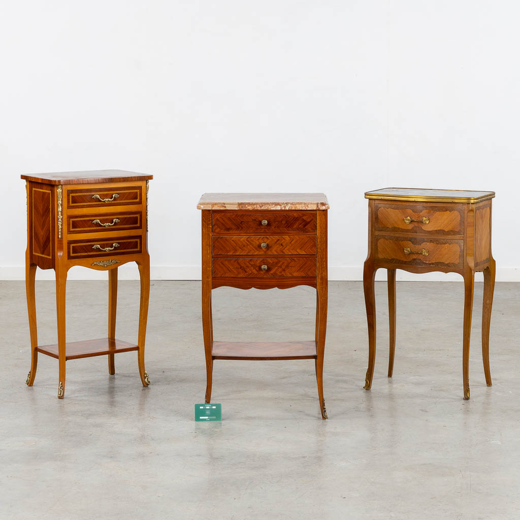 Three side tables, marquetry inlay. Two with a marble top. Circa 1980. (L:33 x W:42 x H:70 cm)