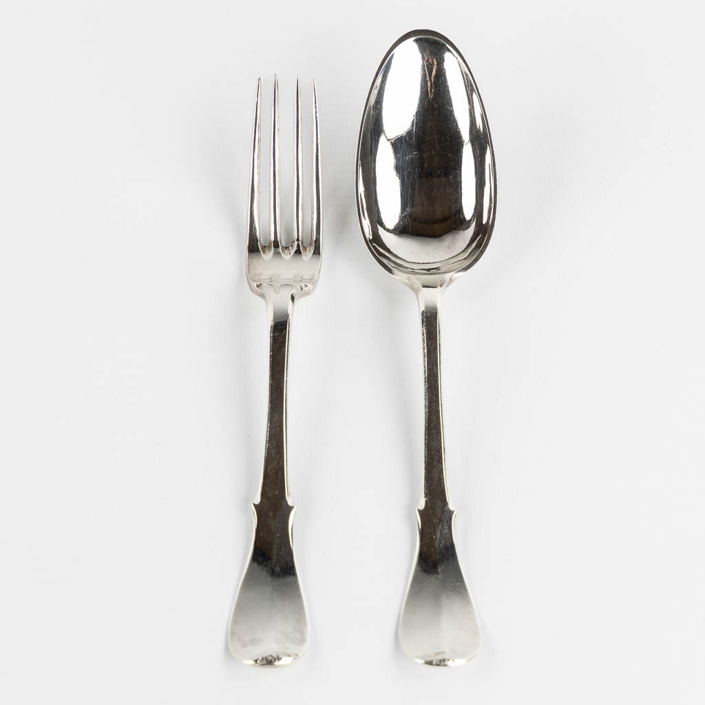 Pieter Frère, Bruges, a silver spoon and fork. 1779. (L:20 cm)