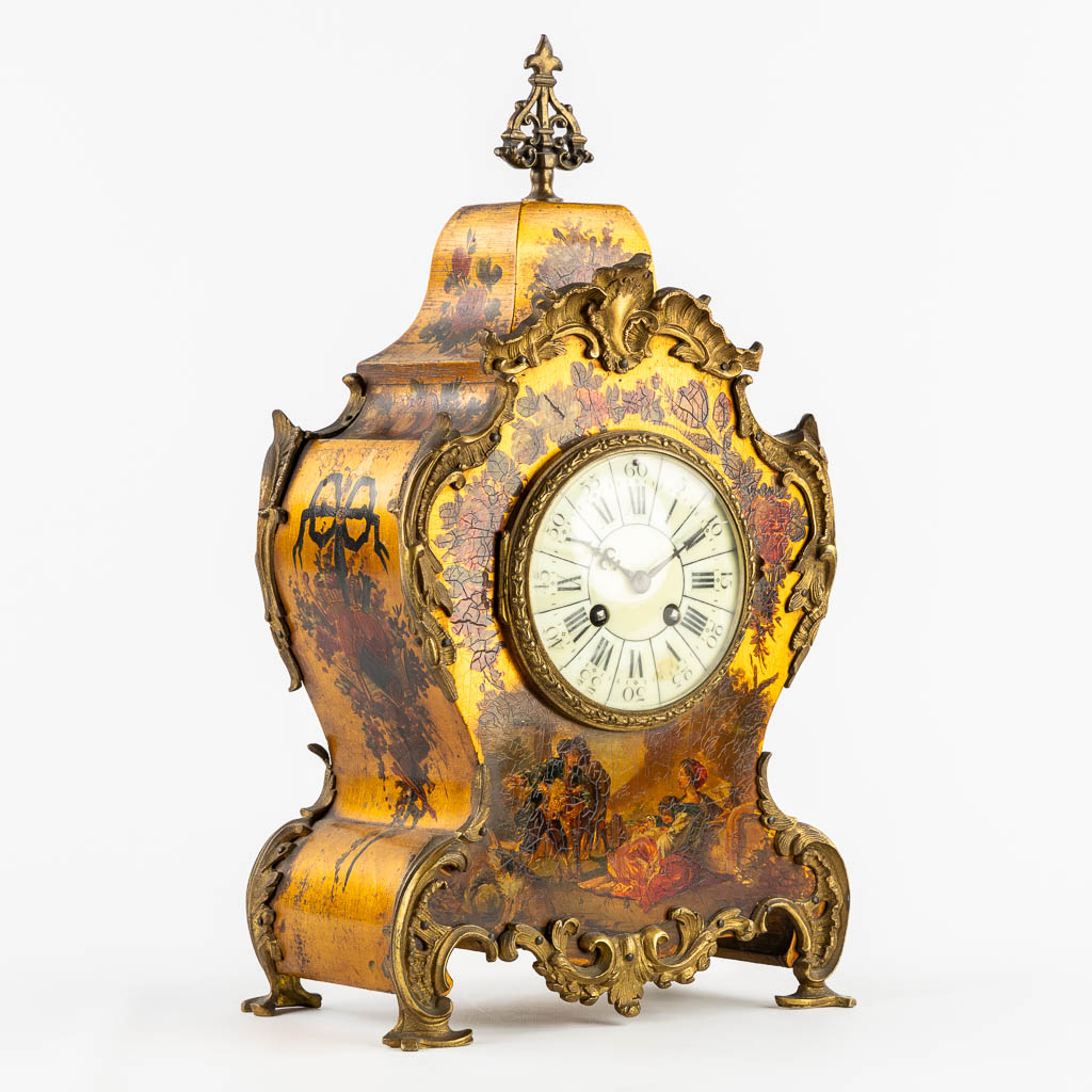 A cartel clock, hand-painted floral decor, mounted with bronze. (c.1900). 