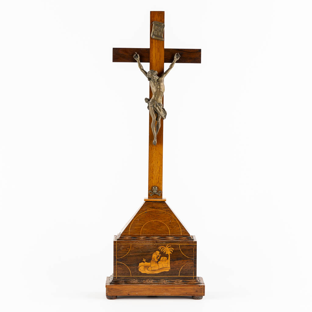 A bronze Corpus Christi mounted on a mahogany and marquetry inlay crucifix.