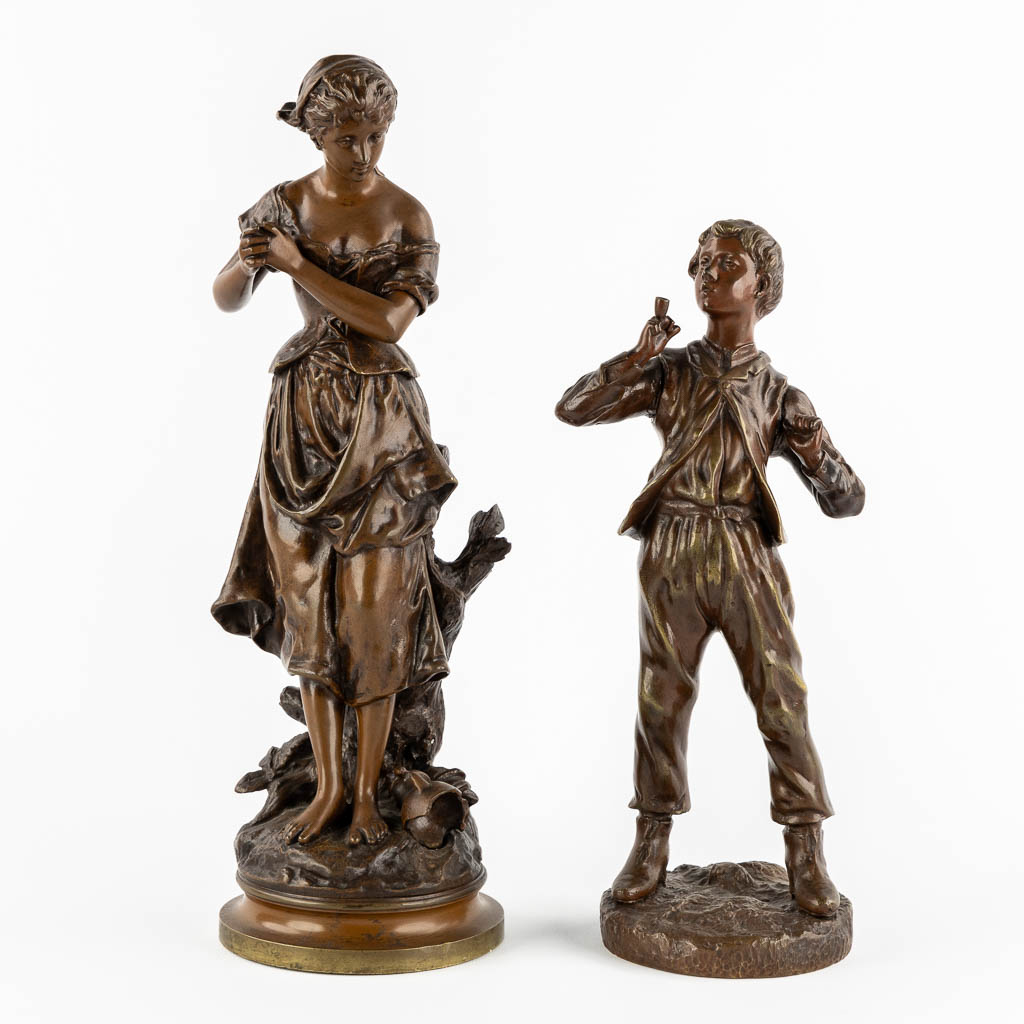 Twee gepatineerde bronzen figuren van een Dame en Roker, circa 1900.