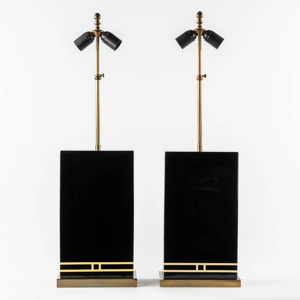 A pair of black-lacqured and brass inlay table lamps, in the style of Maison Jansen. (L:16 x W:24 x H:83 cm)