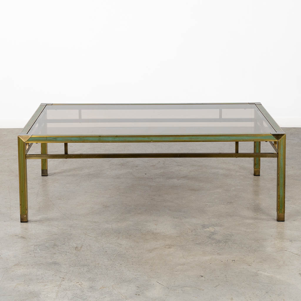 A mid-century coffee table, brass and glass in the style of Belgo Chrome. (L:88 x W:128 x H:43 cm)