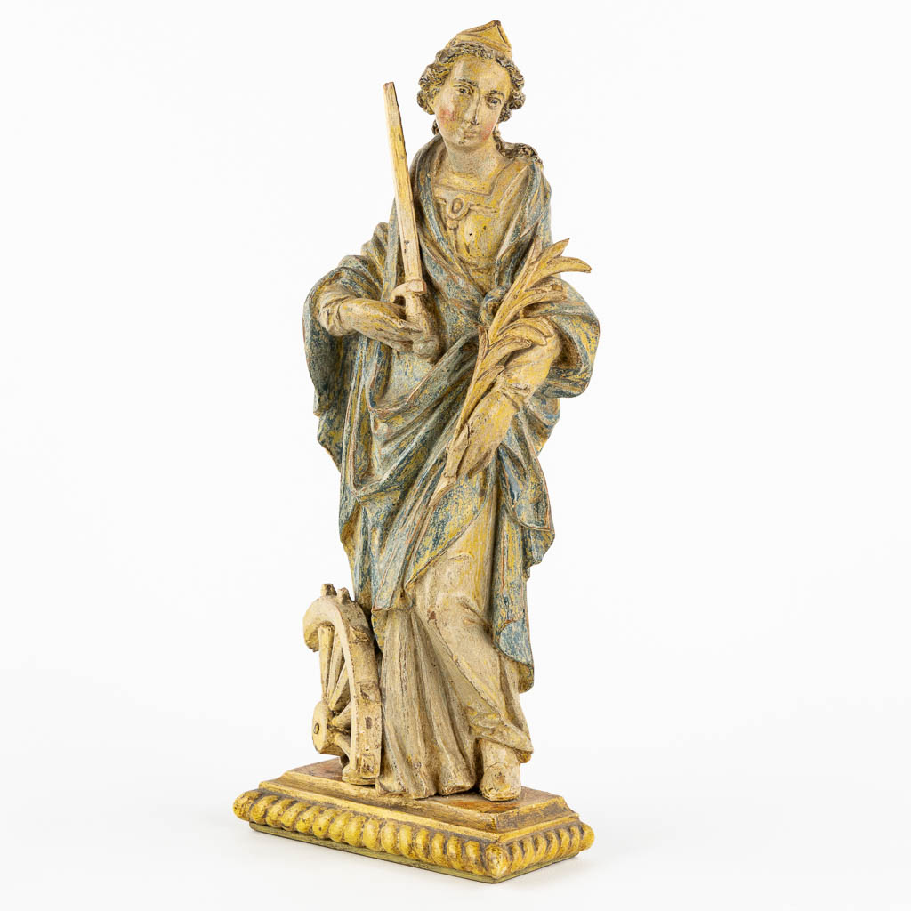 Saint Catherine, an antique wood sculpture, probably 18th C. (L:8 x W:13 x H:32 cm)