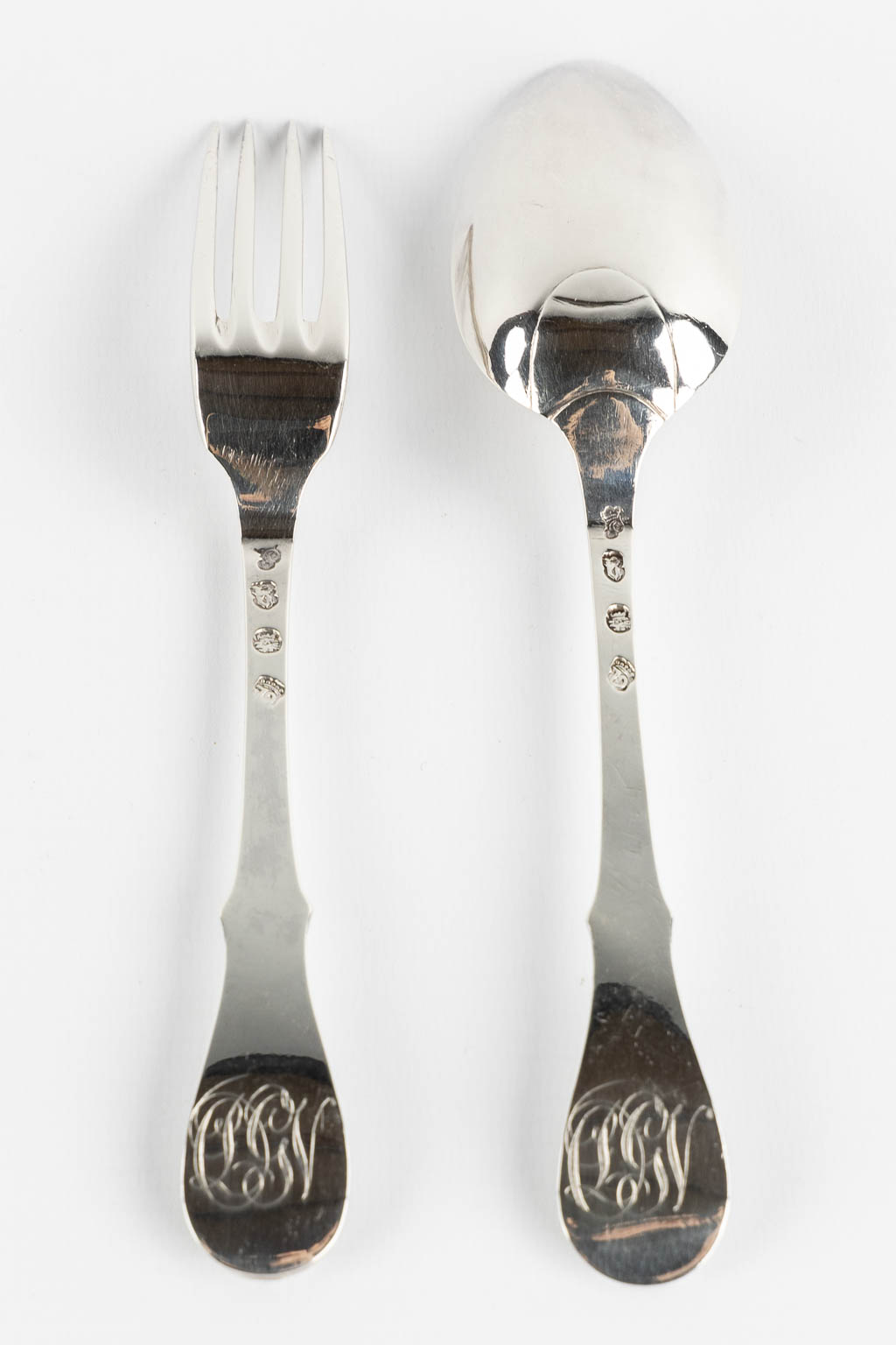 Pieter Frère, Bruges, a silver spoon and fork. 1779. (L:20 cm)