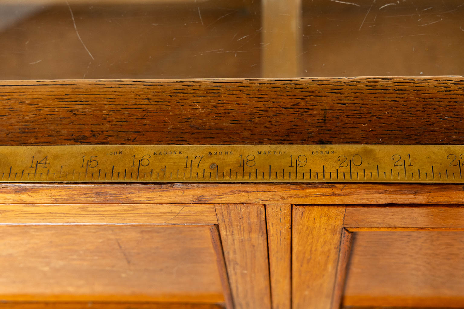 Dudley & Co, Ltd, An antique English shop display cabinet, shop counter, Showcase. Wood and glass. (L:58 x W:179 x H:91 cm)