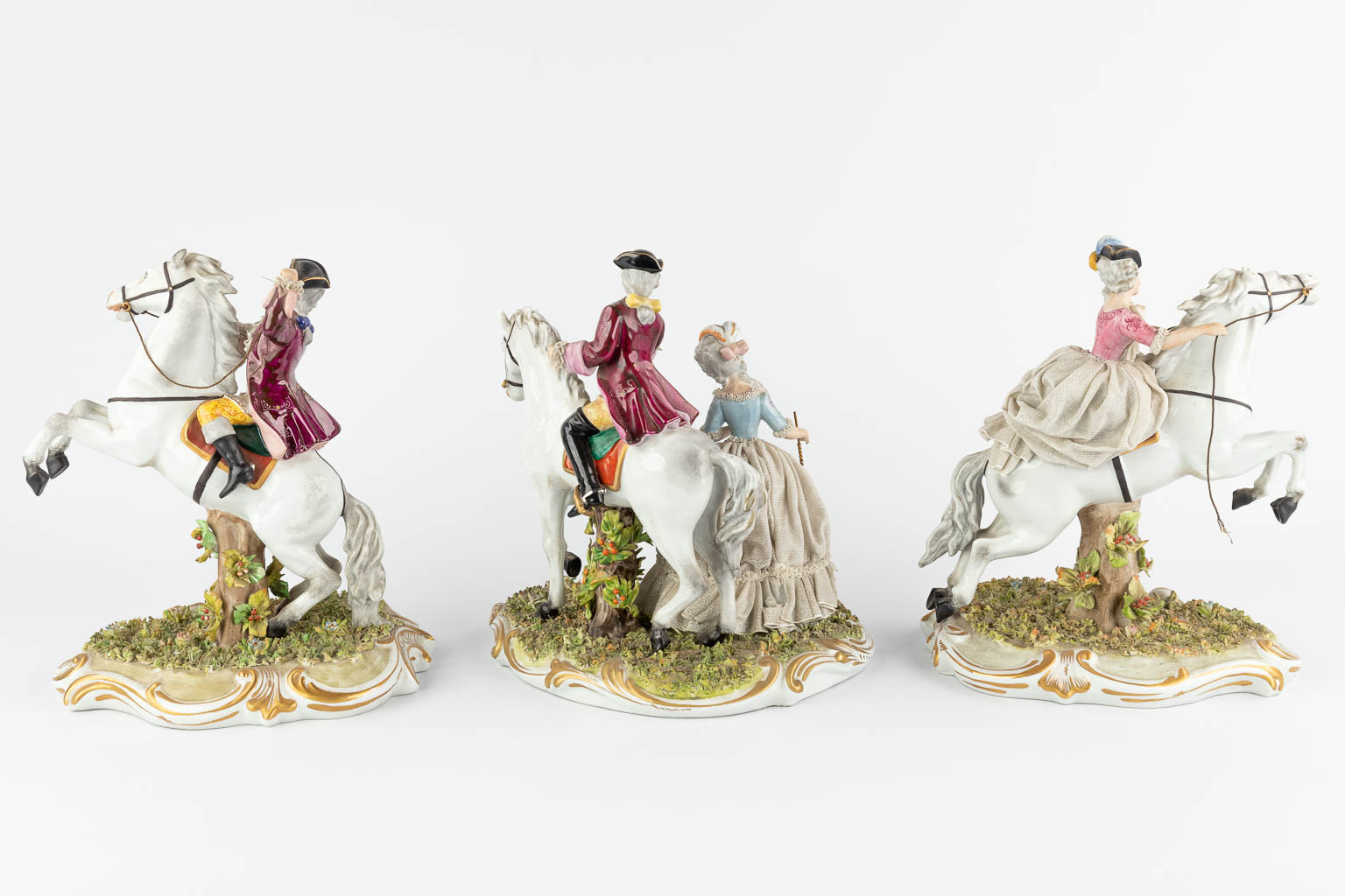 Capodimonte, three groups with horses, 20th C. (W:22 x H:26 cm)