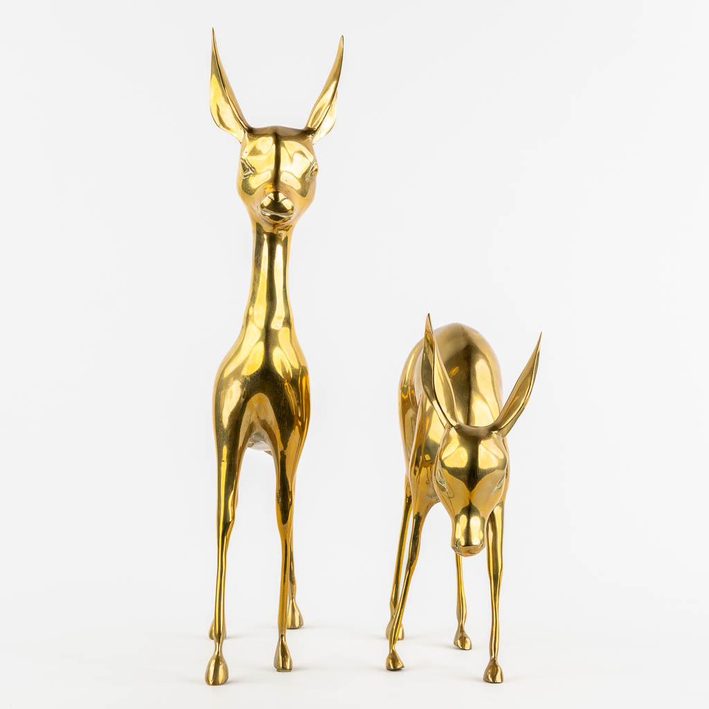 A pair of brass deer, Hollywood Regency style. (W:56 x H:33 cm)